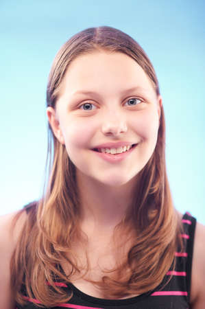 Portrait of a beautiful smiling teen girlの写真素材