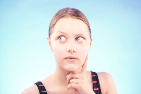 Teen girl look away and thinking