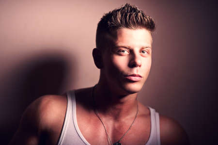 Portrait of a handsome strong bodybuilder posingの写真素材