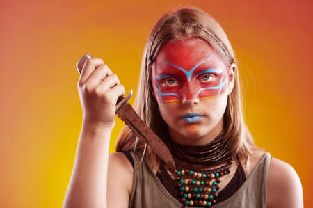 Beautiful indian girl with make-up holding knifeの写真素材