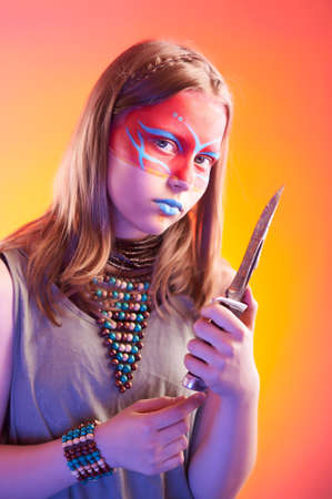 Beautiful indian girl with make-up holding knifeの写真素材