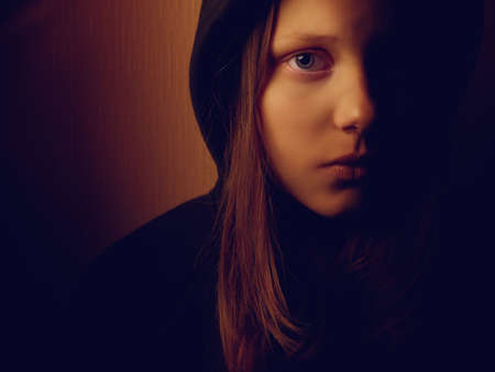 Portrait of a depressed teen girl. Pain and fear.の写真素材