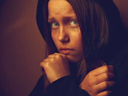 Portrait of a depressed teen girl. Pain and fear.の写真素材