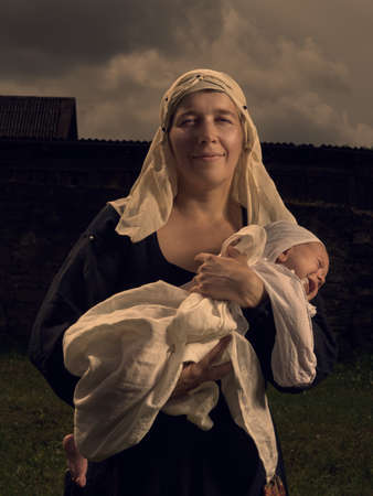 Portrait of a mother and child in medieval dress.の写真素材