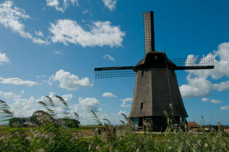 Dutch windmill against a blue skyの写真素材