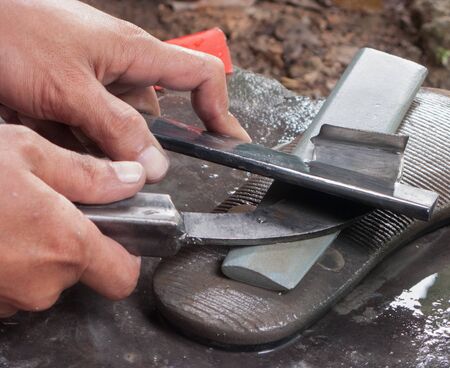 Sharpen rubber tapping knifeの写真素材