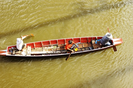 PATHUMTHANI, THAILAND - OCTOBER 16 : Unidentified people have to travel by boat on the road during...