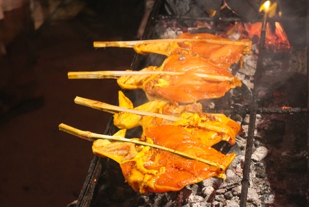Raw chickens in skewer on the grillの写真素材