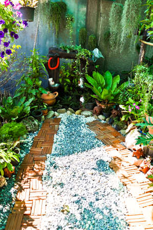 A stone walkway meandering through a garden.の写真素材