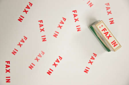 Office Stamp with the words FAX in a paperの写真素材