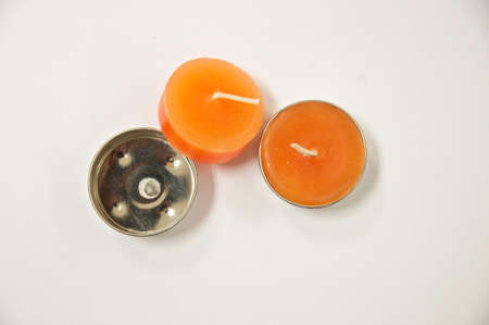 two orange  candle on white backgroundの写真素材