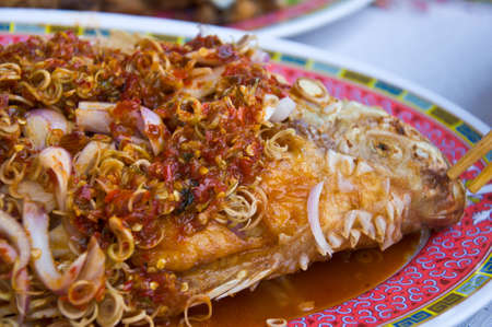 Fried snapper with chili sauceの写真素材