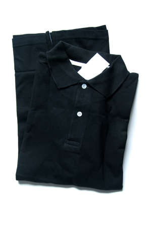 black polo shirt isolated on whiteの写真素材