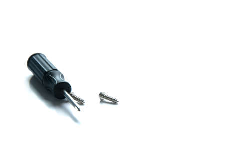 Isolated screwdriver with some screwsの写真素材