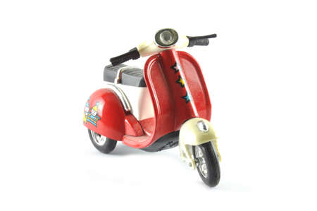 Mini model of old motorcycle isolated on white backgroundの写真素材