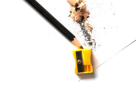 A pencil being sharpened, isolated on white backgroundの写真素材