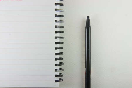 Notebook and pen isolated on white