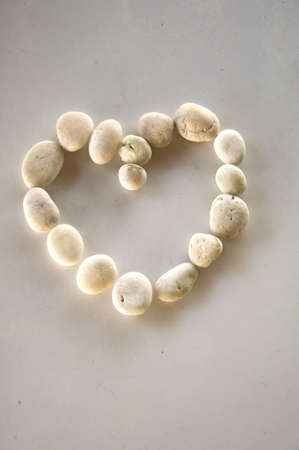 Stone heart isolated on white backgroundの写真素材