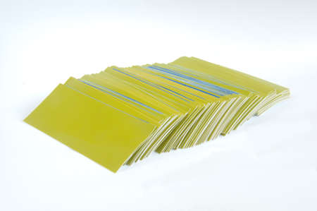 Pile of green paper, isolated on white backgroundの写真素材
