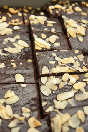 Closeup of square chocolate brownie with nutsの写真素材