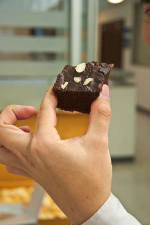 keep brownies cake and bite eatingの写真素材