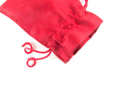 Red velvet bag for gift`s and jewelery isolated on whiteの写真素材