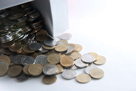 thai coin pile in box on white backgroundの写真素材