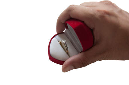 Man in holding engagement ring on white isolated backgroundの写真素材