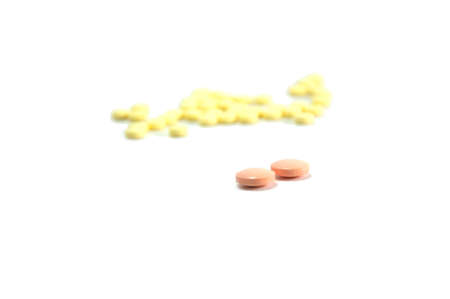 two orange pill on white backgroundの写真素材