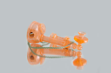 toy orange vintage telephoneの写真素材