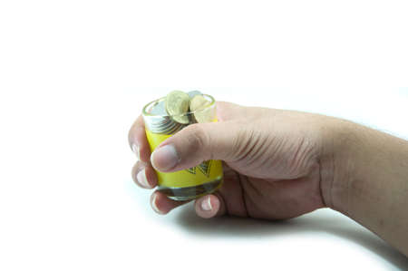 Money in the hand on white backgroundの写真素材
