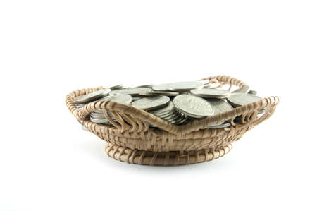 Thailand coins in basket bamboo on white backgroundの写真素材