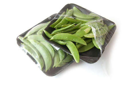 peas in pack isolated on white backgroundの写真素材