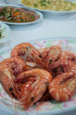 grill shrimp in plate on dining tableの写真素材