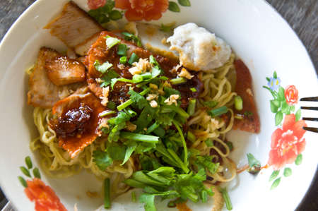 Asian style noodle with roasted red porkの写真素材