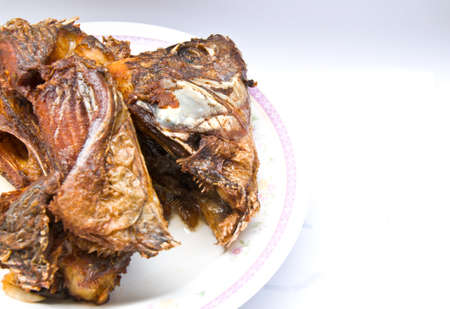 Fried fish thailand on a white dishの写真素材