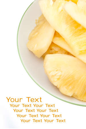 Dish with slices of pineapple on a white background の写真素材