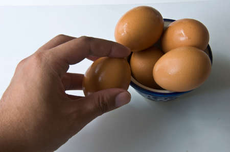 hand keep fresh hen eggs  Isolated on white withの写真素材