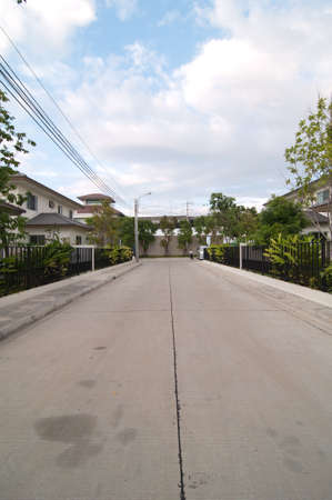 Long, lonely road in front of blue skyの写真素材
