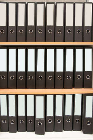 office folders on wooden shelf
