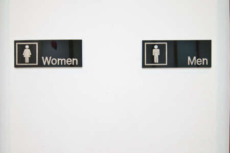 Sign of public toilets one white wallの写真素材