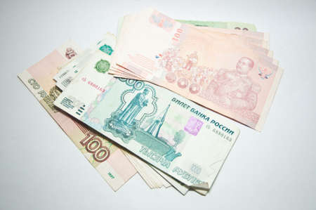Russian rubles banknotes and Thai bath