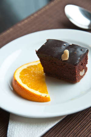 Chocolate cake  and slice of oranceの写真素材