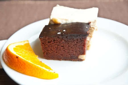 Chocolate cake and slice of oranceの写真素材