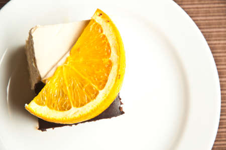 cake and slice of orance top viewの写真素材