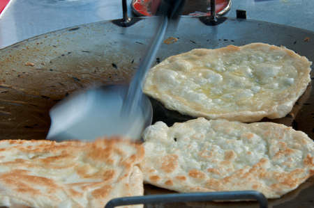 business man make indian food gourmet Southern Flat Bread Fry Pan roteeの写真素材