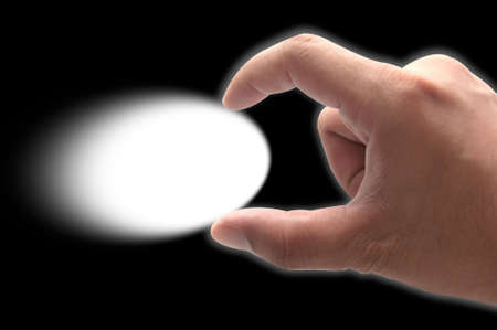 Human hand keeping something with two fingersの写真素材