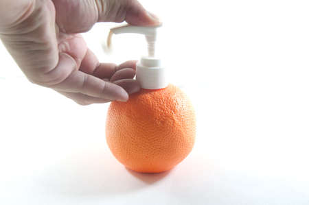 pressing the liquid soap to  handの写真素材