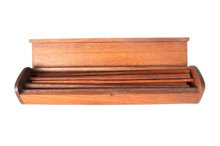 wood chopsticks in wood box on whiteの写真素材