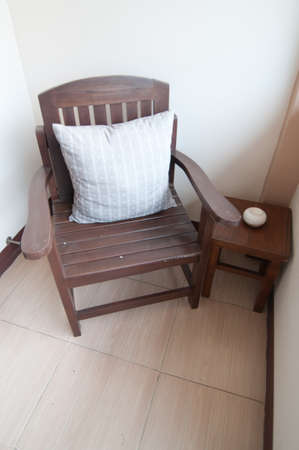 Pillows on a wooden chair の写真素材